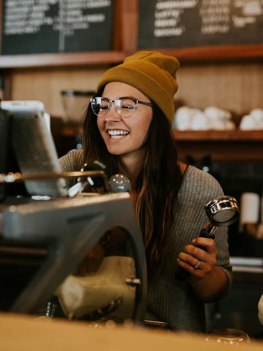 A shop owner behind the counter
